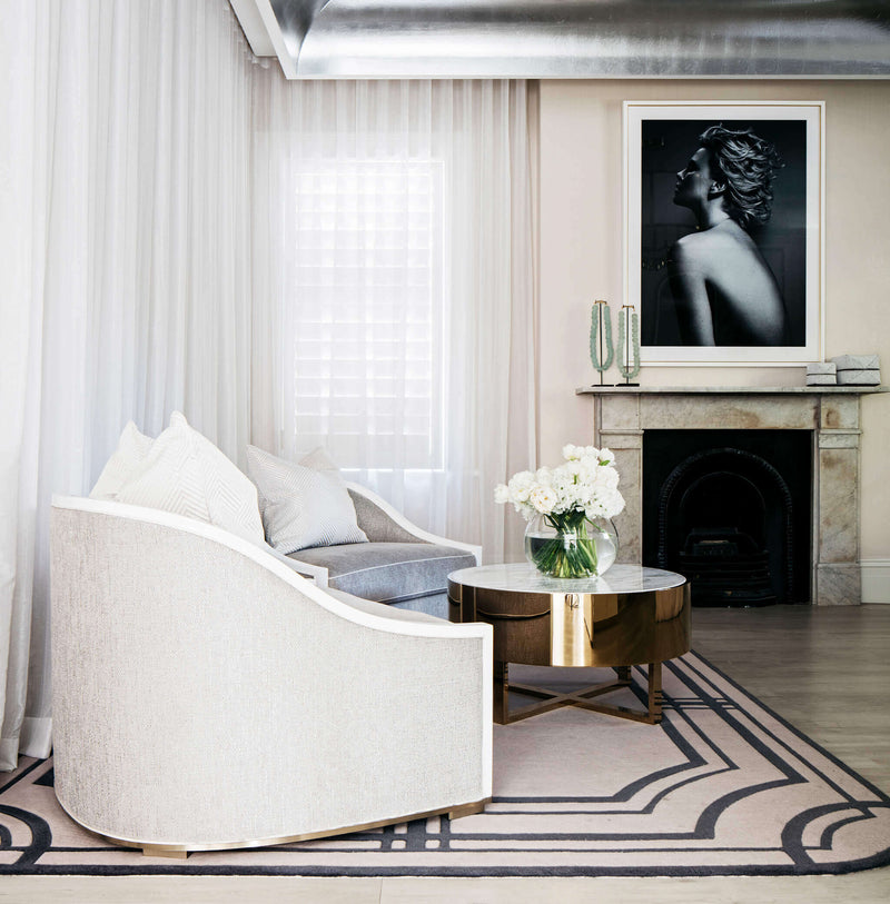 Art deco VIP Suite with a white sofa, coffee table, and decorative elements At All Saint Clinic Double Bay - Designed by infamous Interior Design Blainey North. All Saint Clinic was founded in 1999 by Dr Joseph Hkeik.