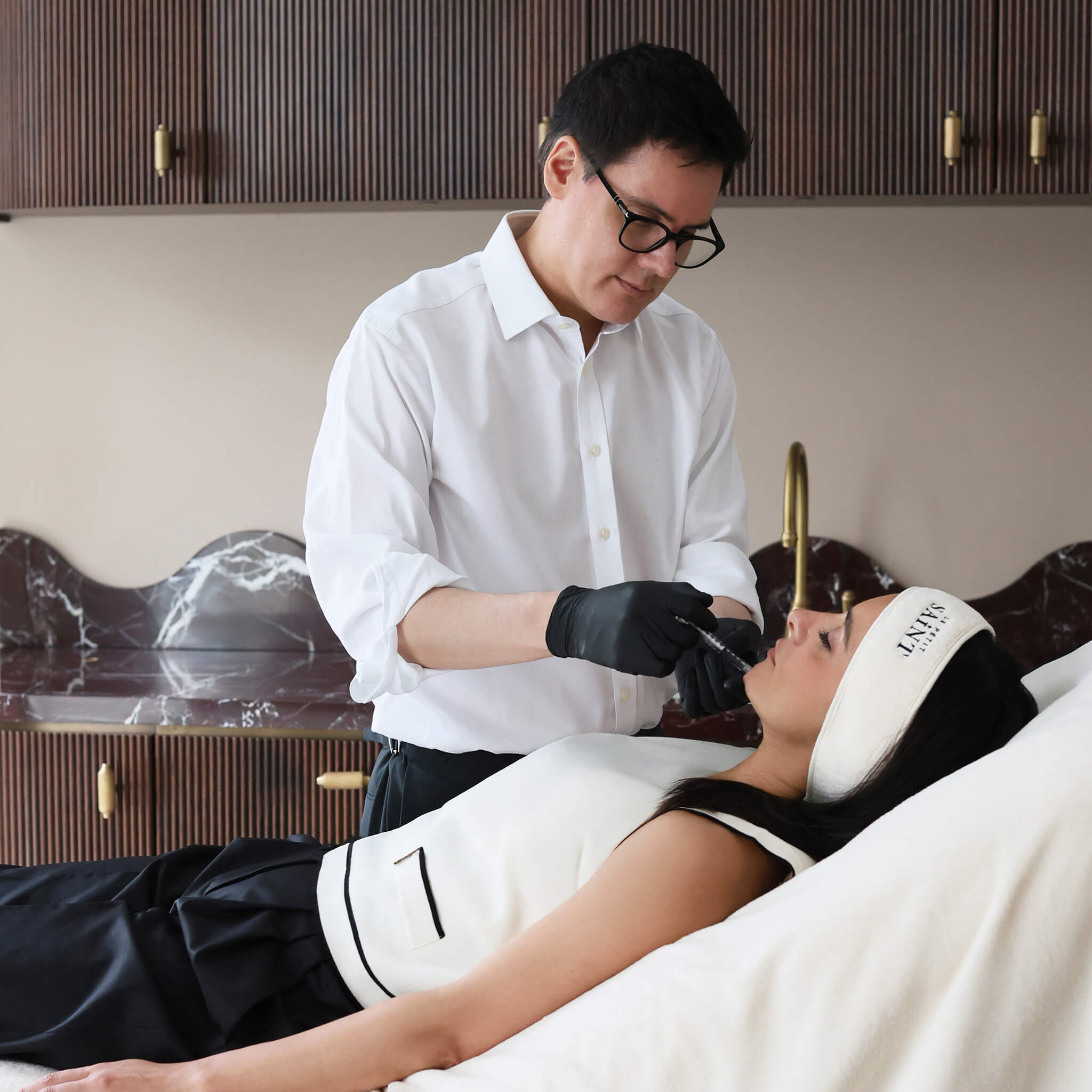 A patient receiving aesthetic injectable from Doctor Raul Cetto the Medical Director at Le Petit Saint