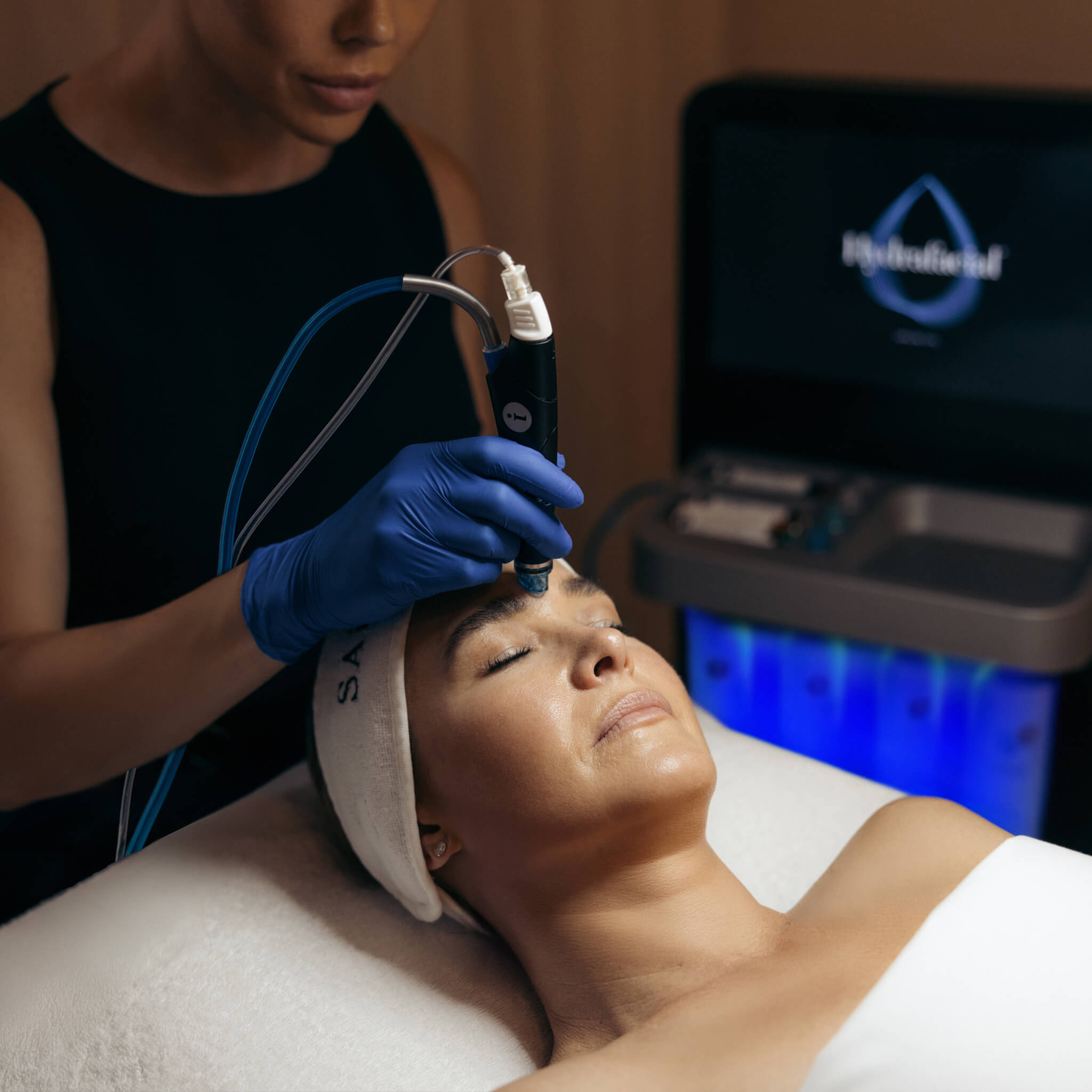 Hydrafacial treatment by a Dermal Therapist to cleanse and hydrate the client's skin. 