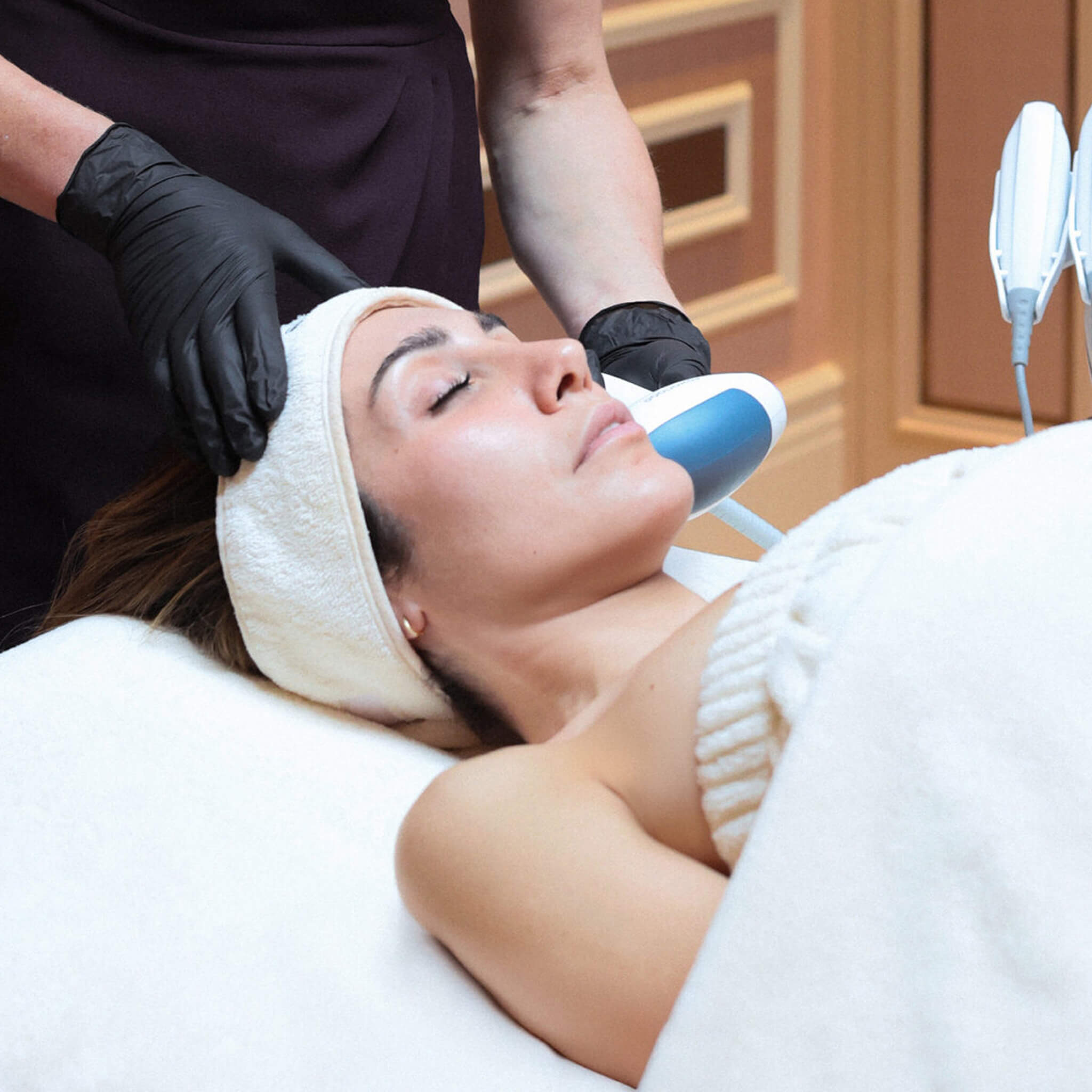 Woman receiving the Saint Rexonage Quantum Lift - a Skin Rejuvenating treatment at Le Petit Saint. 