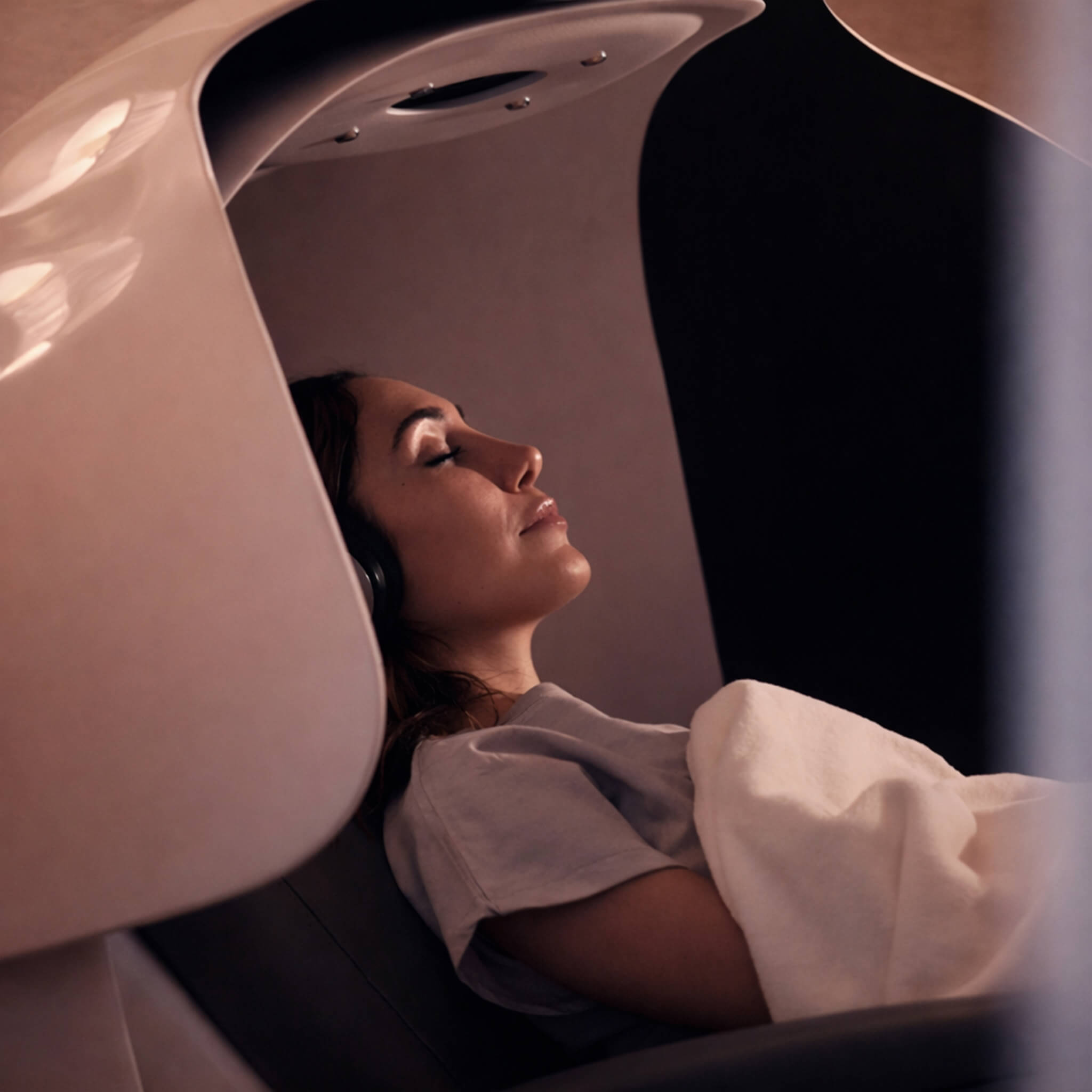A relaxed patient enjoying the Le Petit Saint wellness pod post treatment. 