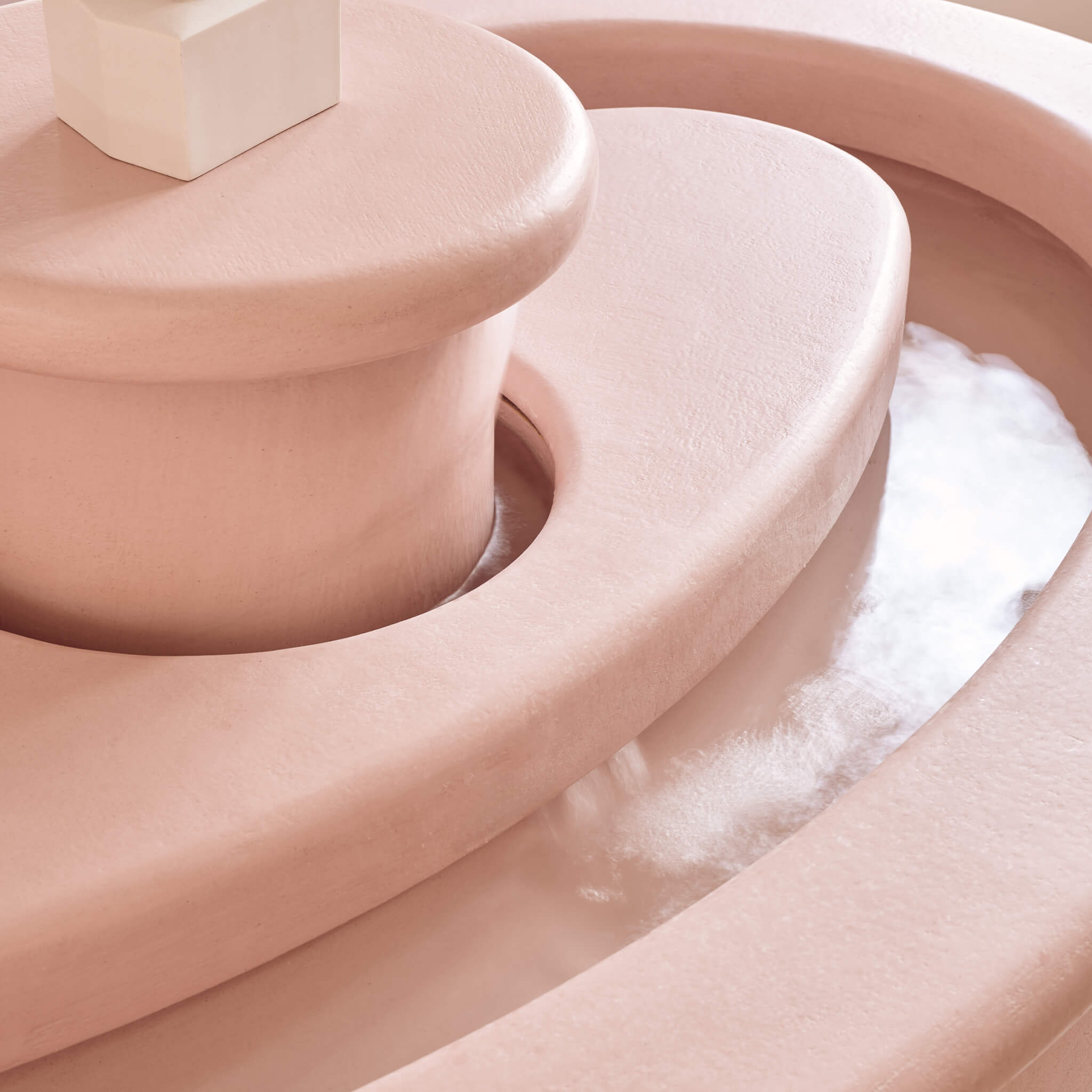 Close up of the serene artistic fountain in Le Petit Saint Mayfair's reception area.