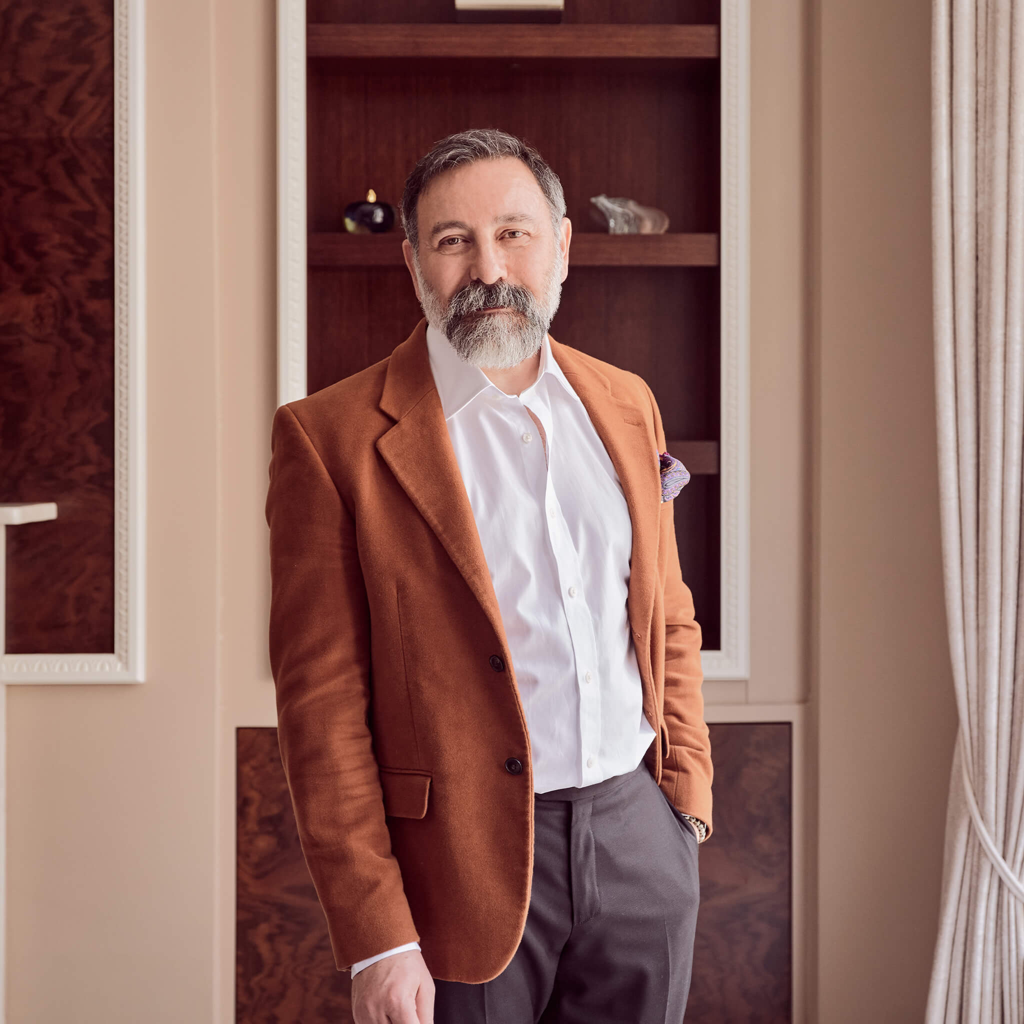 The stylish Aesthetic Physician Dr Joseph Hkeik standing in his Master office. 