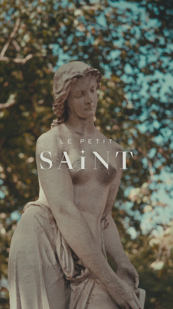 A cinematic video fo Doctor Joseph walking through the streets of london - at the heart of mayfair, towards his beautifully curated aesthetic and wellness clinic "Le Petit Saint". He unlocks the cinder rose door and enters. 