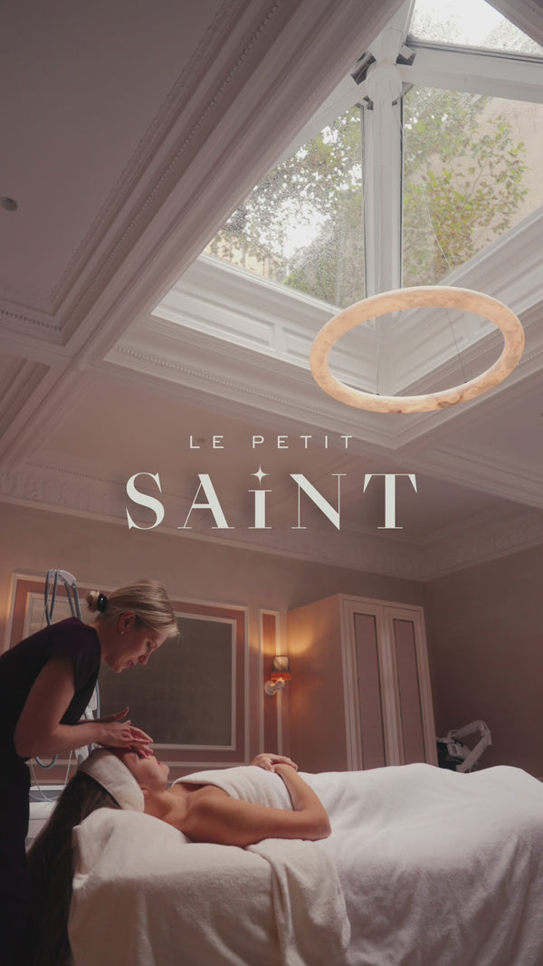 A patient experiencing a relaxing Saint Red Carpet Laser facial, wellness treatments and various laser modalities surrounded by beautiful sculptures and art. Scenes of the clinic space - elevated and refined. 